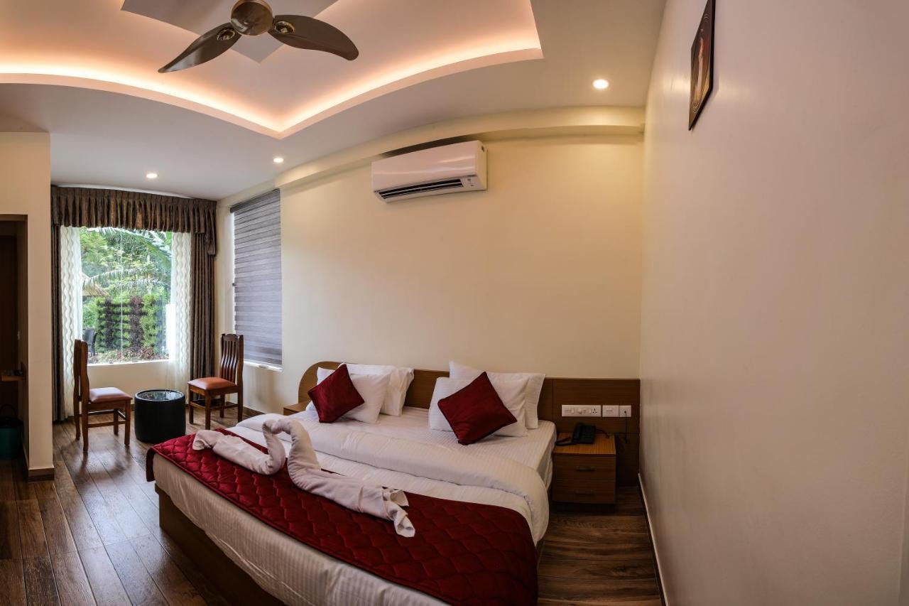 Thenmala Hormuz Inn Kolattupuzha ภายนอก รูปภาพ